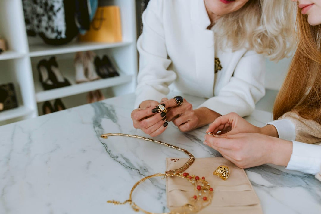 Jewelry designer comparing prototype and CAD printout