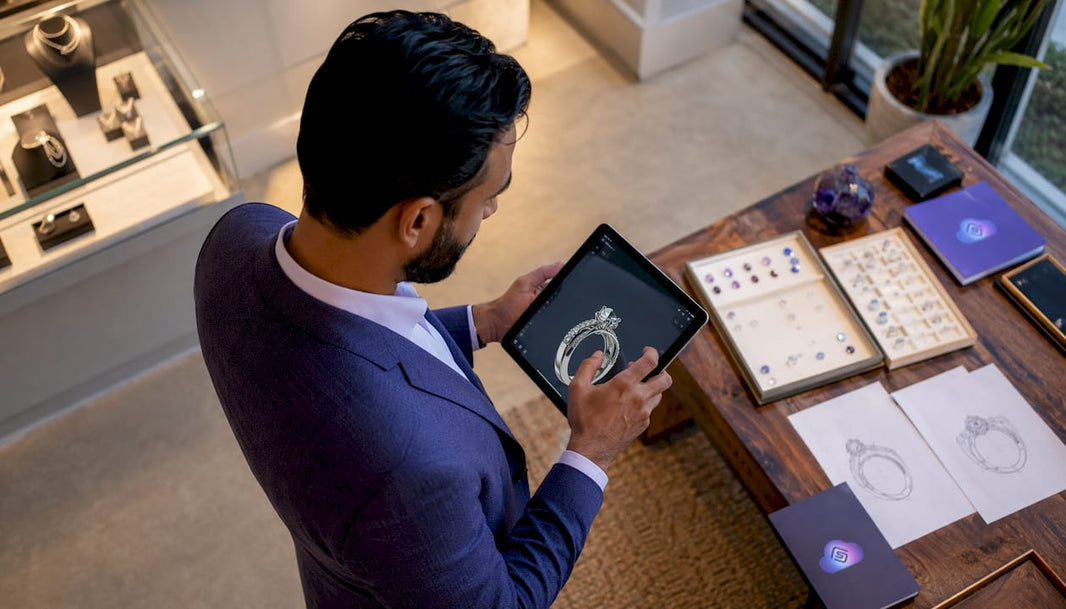 Jeweler interacting with ring configurator software tablet