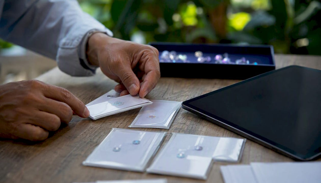 Hands sorting diamond certificates close-up